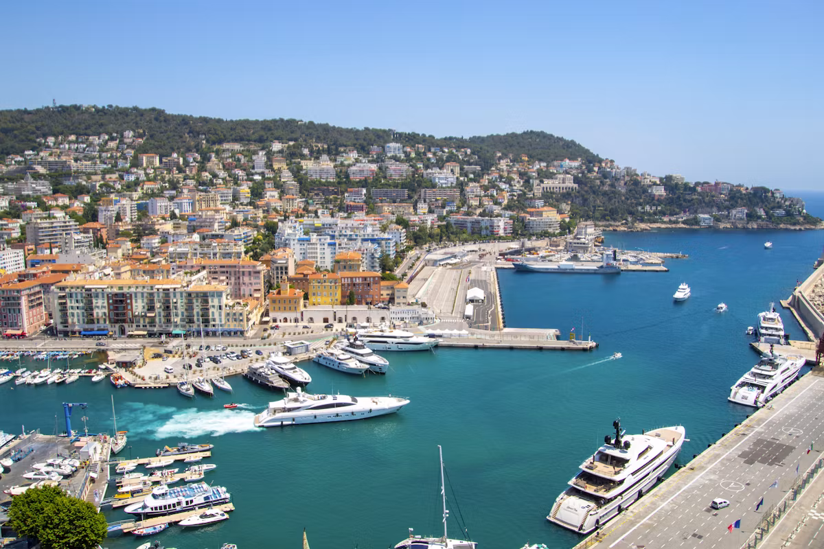 Boats in Port Lympia below the hillside flats of Nice
